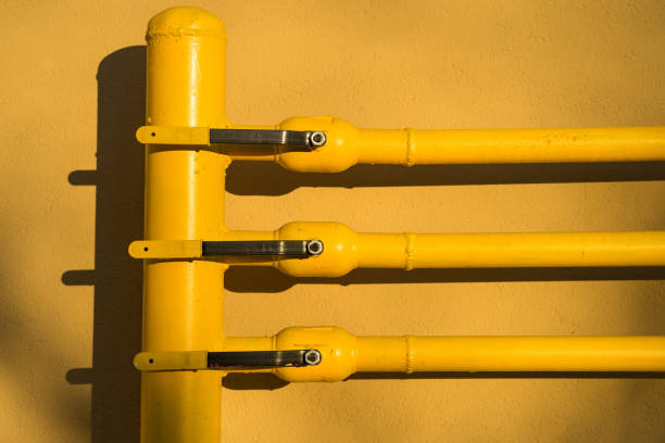 yellow gas pipe with a crane and gear.